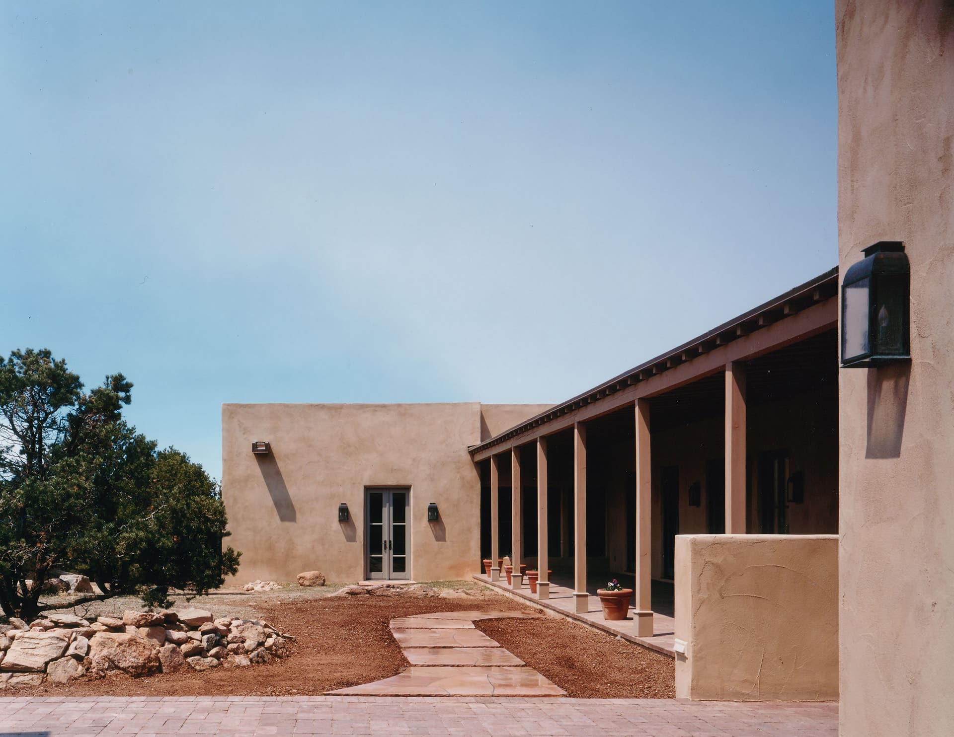 Exterior walkway of Santa Fe ranch home | Rodman Paul Architects