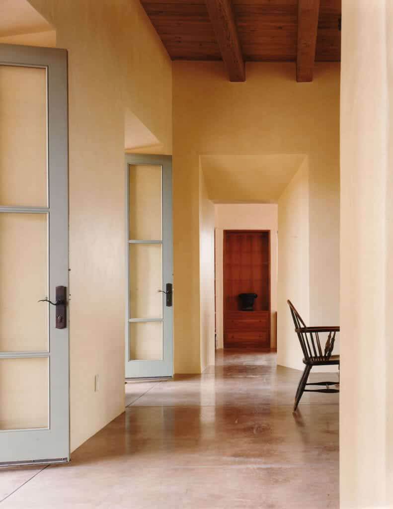 Long interior hallway in Santa Fe, New Mexico ranch home | Rodman Paul Architects